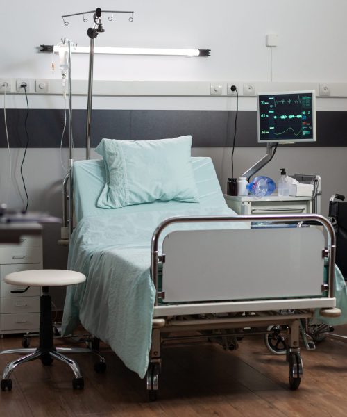 Empty hospital room with nobody in it having a single bed comfortable bed, modern equipment. Recovery room of hospital ward, sterile floor. Ambulatory room after surgery.